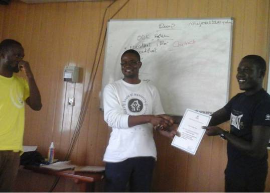From the right to left (Mr. Aliyu of ISOTECH Research Consult, Dr. Amos Laar of HM2R, and Mr Ernest Amoah Ampah receiving his certificate 